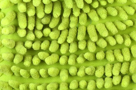 Close up hand bath sponge glove. Macro.