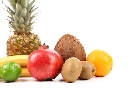 Fruits composition. Grapefruit, pineapple, bananas, pomegranate, orange, coconut, lime, lemon.