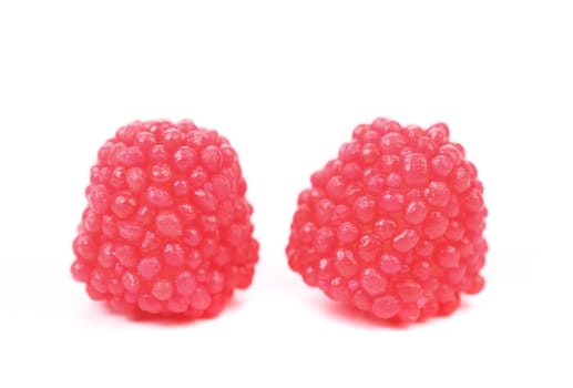 Two red jujube colored balls on a white background