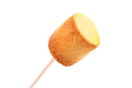 Roasted colorful marshmallow. Close up. White background.