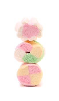 Stack of different colorful marshmallow. Close up. White background.