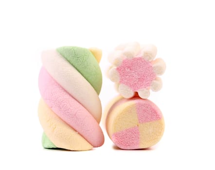 Three different colorful marshmallow. Close up. White background.
