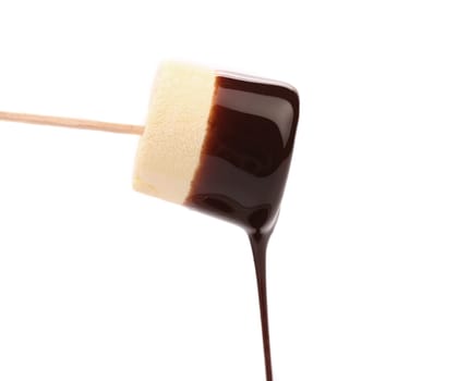 Marshmallow in chocolate syrop. Isolated. White background.