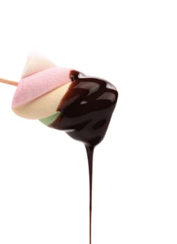 Marshmallow in chocolate syrop. Isolated. White background.