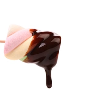Marshmallow in chocolate syrop. Isolated. White background.