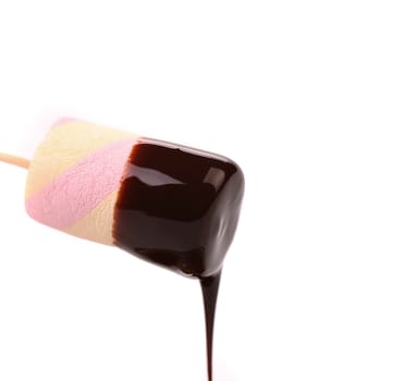 Marshmallow in chocolate syrop. Isolated. White background.
