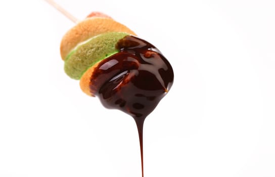 Roasted of marshmallow in chocolate syrop. Isolated. White background.