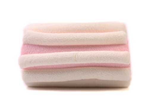 Colourful marshmallow. Close up. Texture. White background.