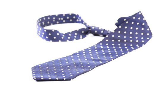 Blue tie with white speck. White background.