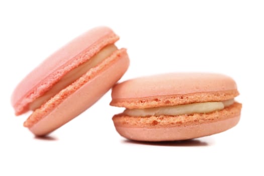 Two pink  macaron cakes. Close up. White background.