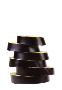 Stack of slices black eggplant. White background.