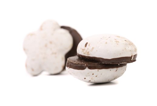 Several different chocolate meringues. Close up. White background.