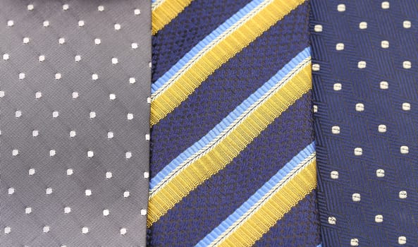 Background of three  multi-colored tie. Half background.