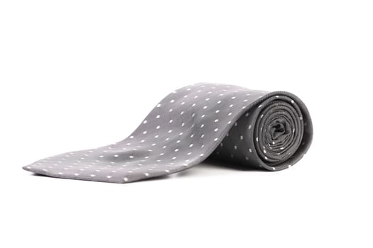 Gray tie with white speck. White background.