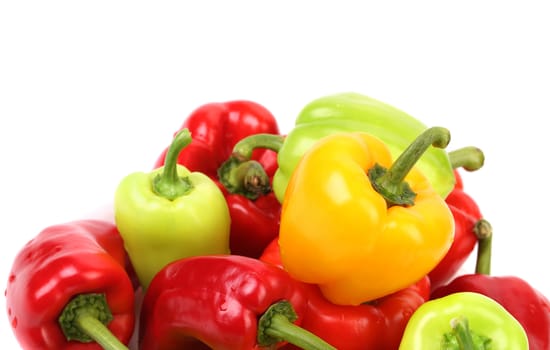 Multi-colored peppers on a white background. Close up.