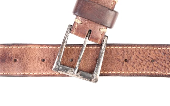 Fradment of brown belt and buckle. White background.