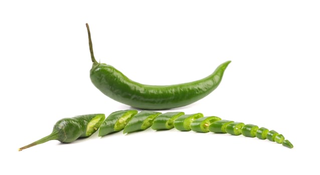 Green chili pepper and slices isolated on a white background