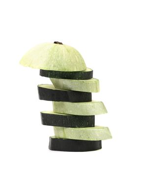 Slices of zucchini and black eggplant. White background.
