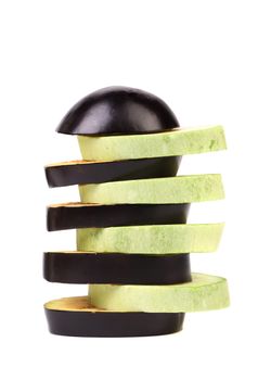 Slices of zucchini and black eggplant. White background.