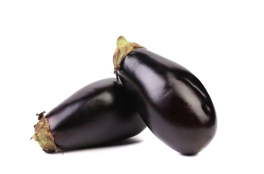 Two black eggplants isolated on a white background.