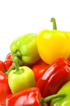 Multi-colour peppers on a white background. Close up.