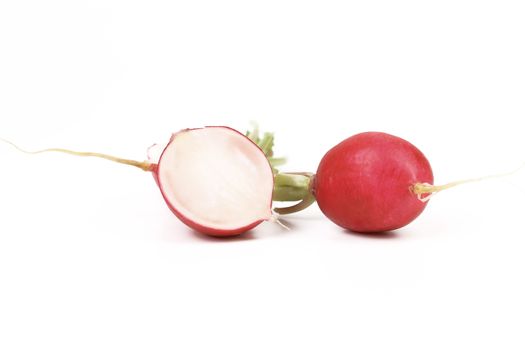 Red radish and slice. Isolated on a white background