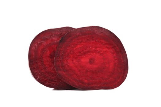 Two beetroot slices isolated on a white background.