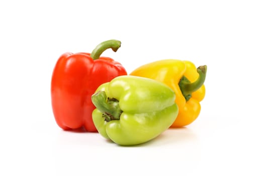 Three colored peppers isolated on a white background