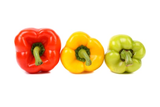 Three colored peppers isolated on a white background