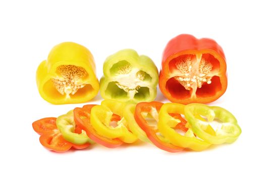 Three half of bell pepper and slices on a white background