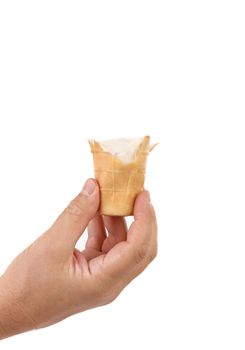 Hand holds bitten ice cream. White background.