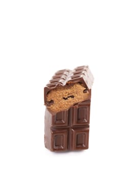 Broken chocolate bar with filling. White background.