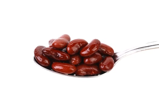 Preserve beans on a spoon. White background.