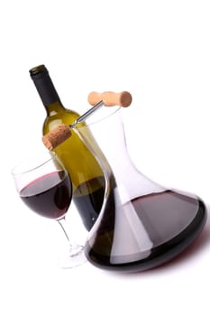 Decanter, bottle and glass with red wine top view. White background.