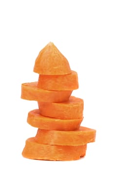 Pile of carrot slices closeup on a white background.