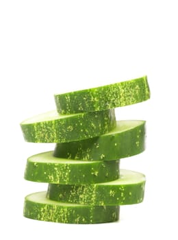 Stack of Sliced Cucumber isolated on a white background