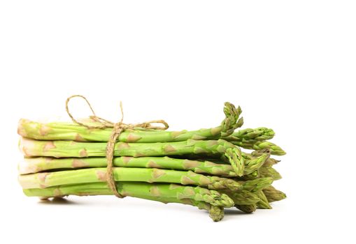 Bunch of fresh asparagus on a white background