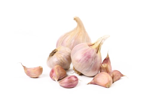Fresh garlic and cloves isolated on a white background.