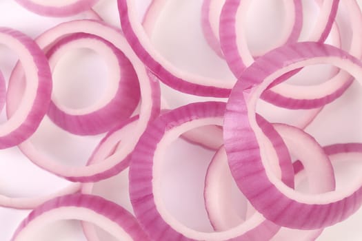 Background of red onion rinds. White background.