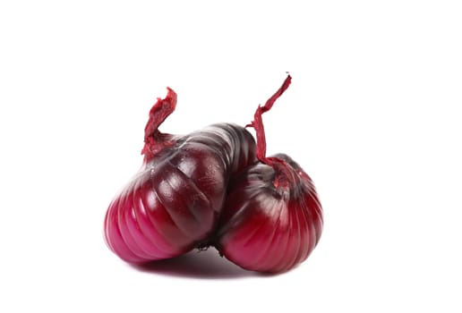 Accrete couple of violet onions. White background.