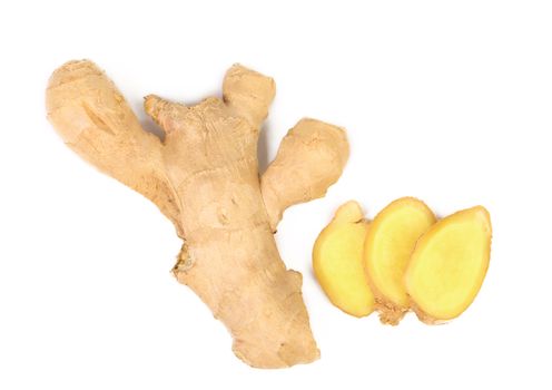 fresh ginger and slices isolated on a white background