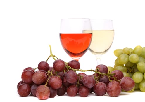glasses of wine and ripe grapes isolated on a white background