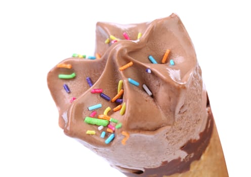 Chocolate ice cream cone. Sprinkles. White background.