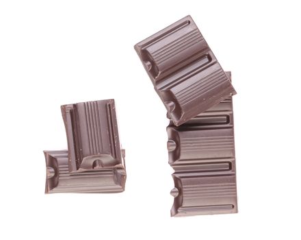 Tasty morsel of dark chocolate. White background.