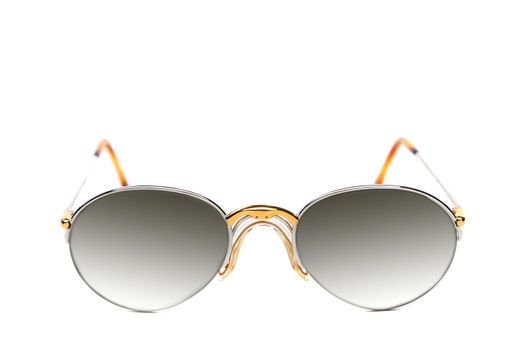 Sunglasses of yellow and white gold on a white background.
