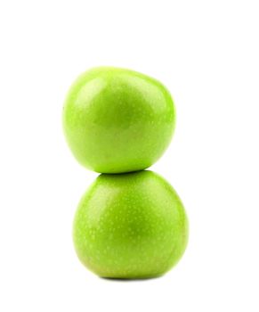 Two green apples. Vertical. Close up. White background.