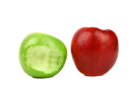 Apples. Green bitten and red. White background.