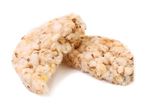 Two halfs of rice cake. White background.