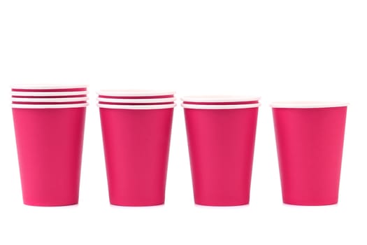 Colorful paper coffee cup. Close up. White background.