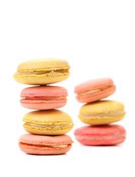 Stack of traditional French macarons against a white background.